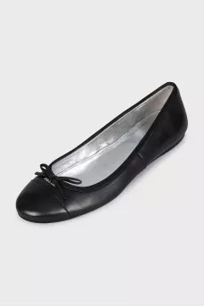 Black leather ballet flats with a bow