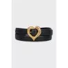 Leather belt with a heart-shaped buckle