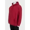 Men's red hoodie with a print on the back