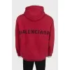 Men's red hoodie with a print on the back