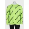 Green oversized jumper with a signature monogram
