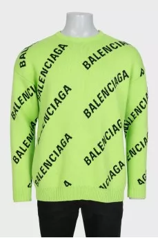 Green oversized jumper with a signature monogram
