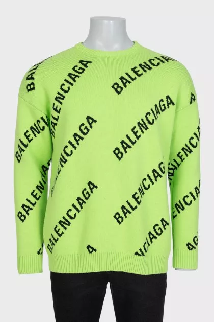 Green oversized jumper with a signature monogram