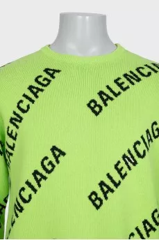 Green oversized jumper with a signature monogram