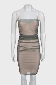 A fitted dress decorated with mesh
