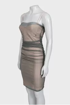 A fitted dress decorated with mesh