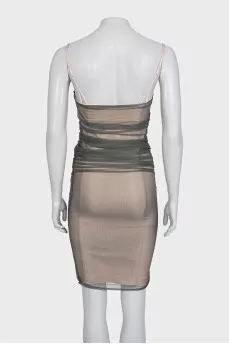 A fitted dress decorated with mesh