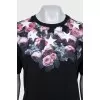 Straight black T-shirt with a floral print