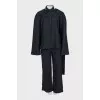 Black suit with trousers, top and cape