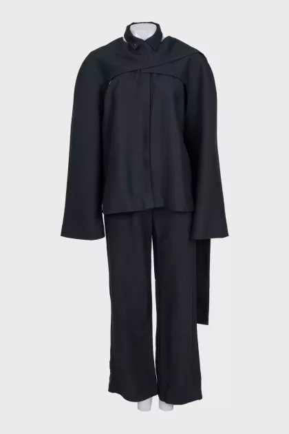 Black suit with trousers, top and cape