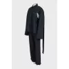 Black suit with trousers, top and cape