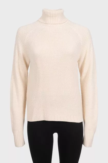 Beige knitted turtleneck sweater