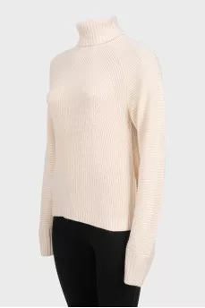 Beige knitted turtleneck sweater