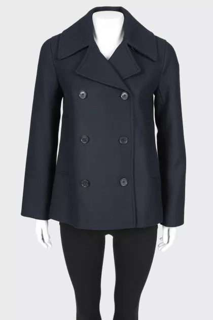 A shortened coat on a double -breasted fastener, with a tag