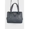 Dark blue bag with gold hardware