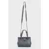 Dark blue bag with gold hardware