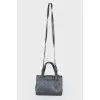 Dark blue bag with gold hardware