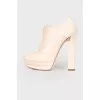 Beige perforated ankle boots