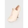 Beige perforated ankle boots