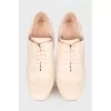 Beige perforated ankle boots