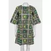 Coat with a print on the buttons