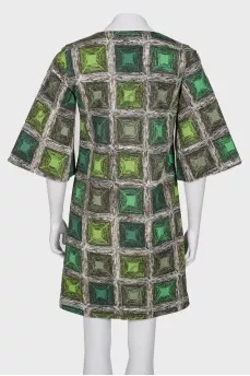 Coat with a print on the buttons