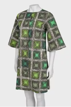 Coat with a print on the buttons