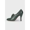 Green ankle boots with perforation