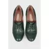 Green ankle boots with perforation