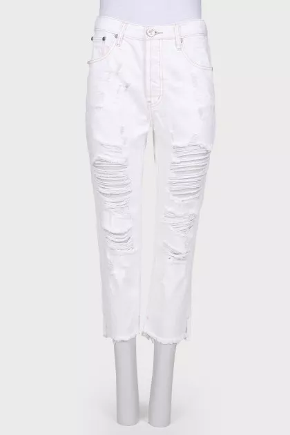 Ripped jeans, with a tag