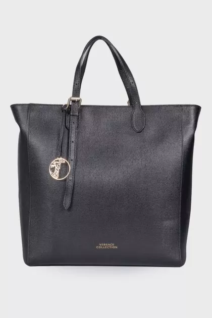 Leather bag with branded accessory
