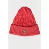 Bright pink hat with a brand logo