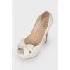 White shoes with a bow