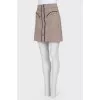 Skirt with fringe and buttons