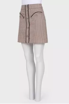 Skirt with fringe and buttons