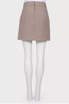 Skirt with fringe and buttons