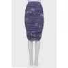 Skirt with drape with a tag