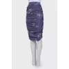 Skirt with drape with a tag