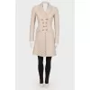 Fitted coat with indentations