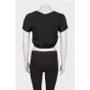 Black top on a zipper with a tag