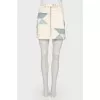 Skirt with geometric inserts with a tag