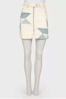 Skirt with geometric inserts with a tag