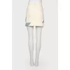 Skirt with geometric inserts with a tag