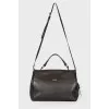 Leather bag with a lock with a key