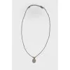 A pendant with a steel chain