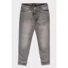Gray jeans boyfriends with a tag