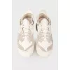Sneakers with a rubber clasp on the heel