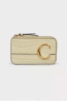 Leather light green wallet with a tag