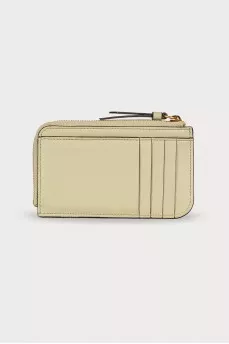 Leather light green wallet with a tag