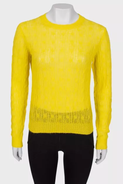 Translucent yellow sweater with a tag